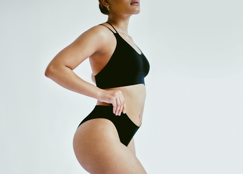 Woman posing in black leotard