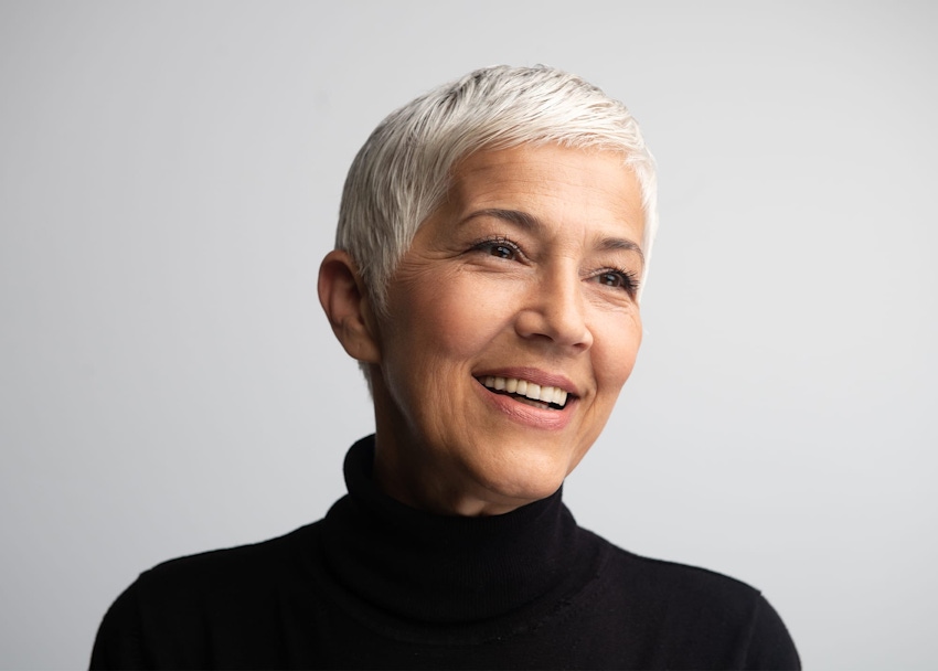 Dr. Goggin with patient looking in mirror