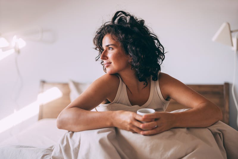 Woman relaxing in bed