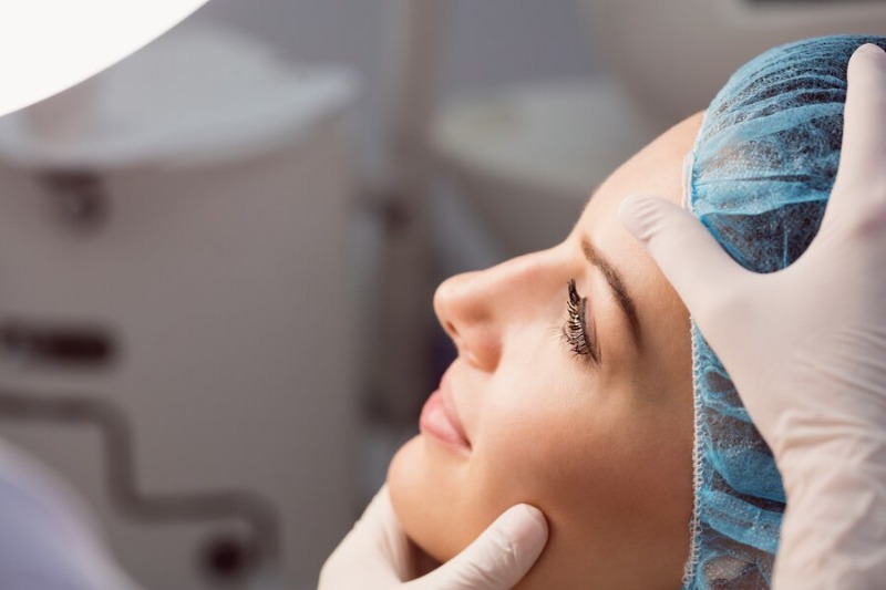 A woman preparing for rhinoplasty procedure