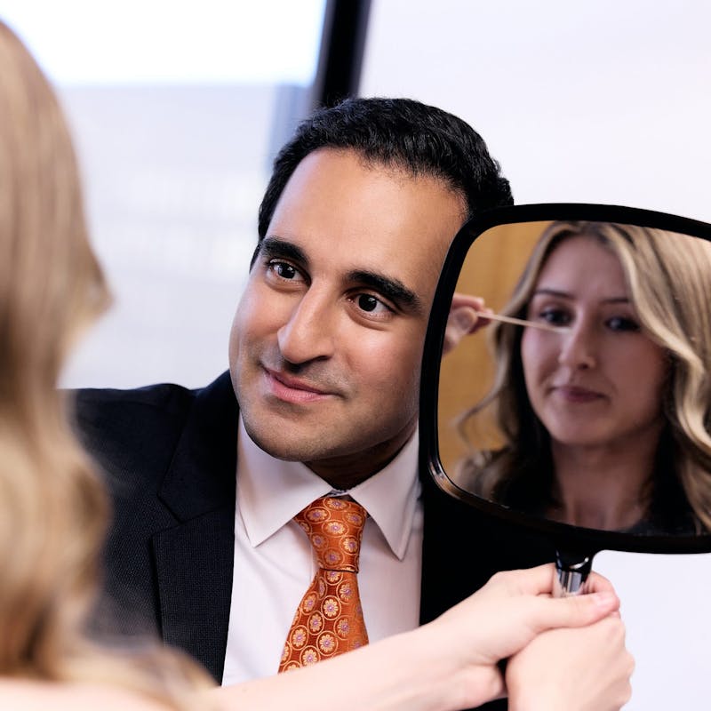 Dr. Dugar checkin a patient