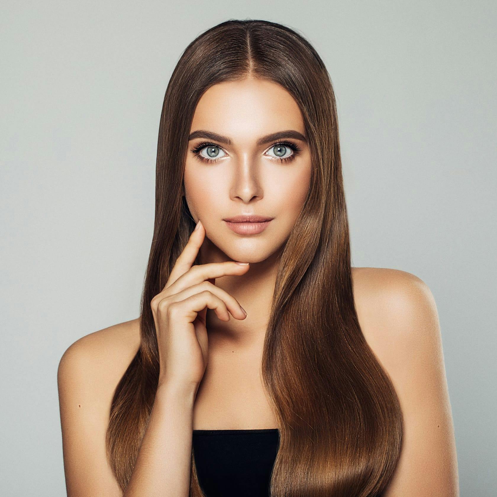 woman touching her face