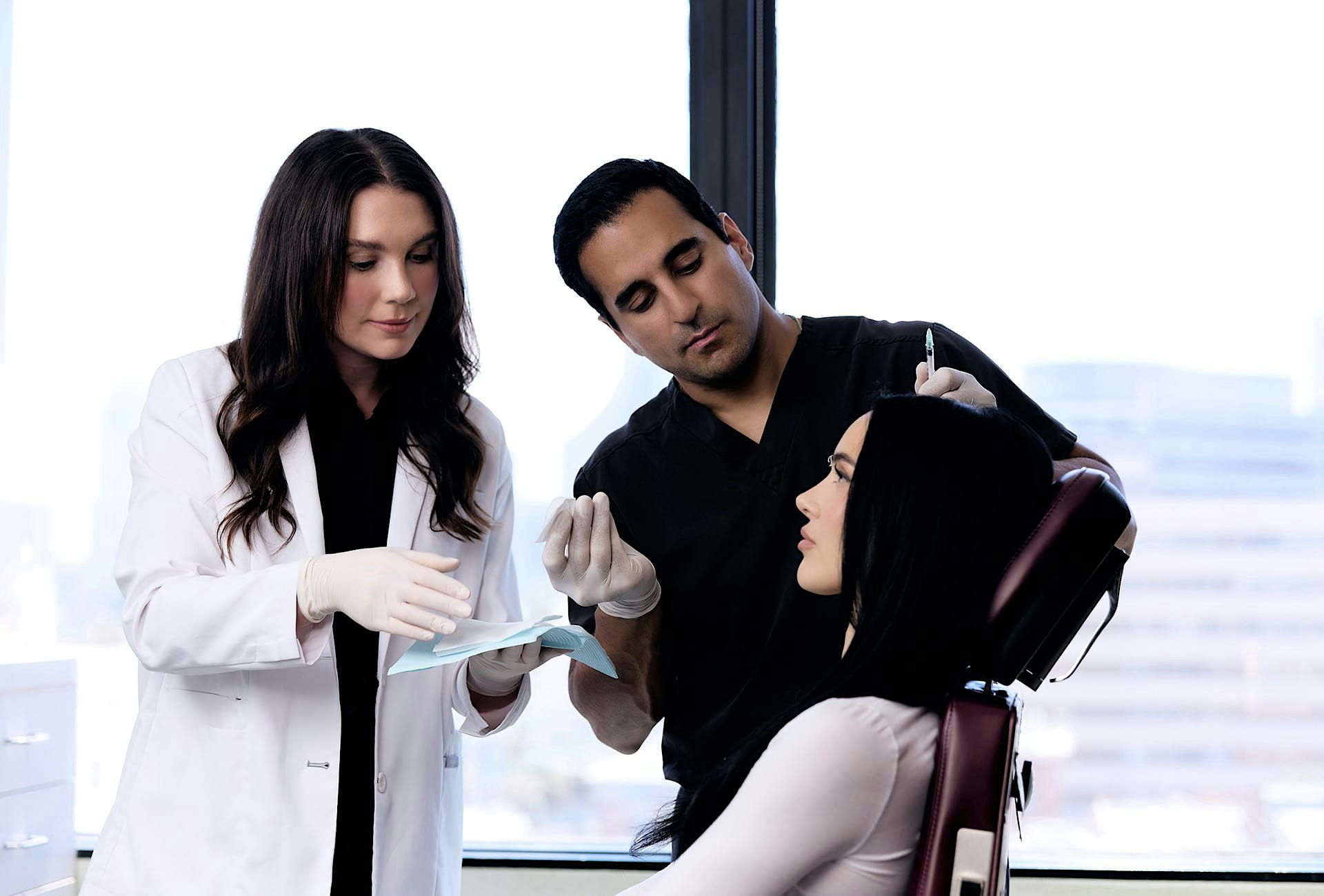 Dr. Dugar injecting a patient