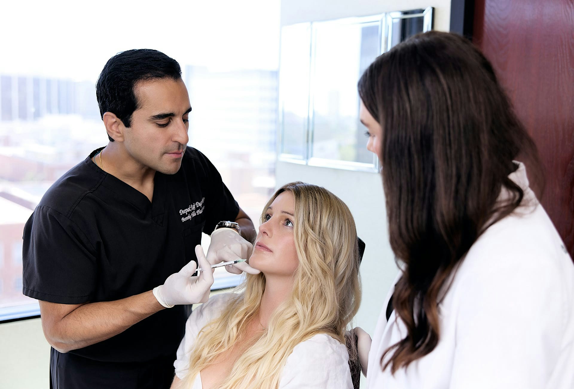 Dr. Dugar injecting a patient