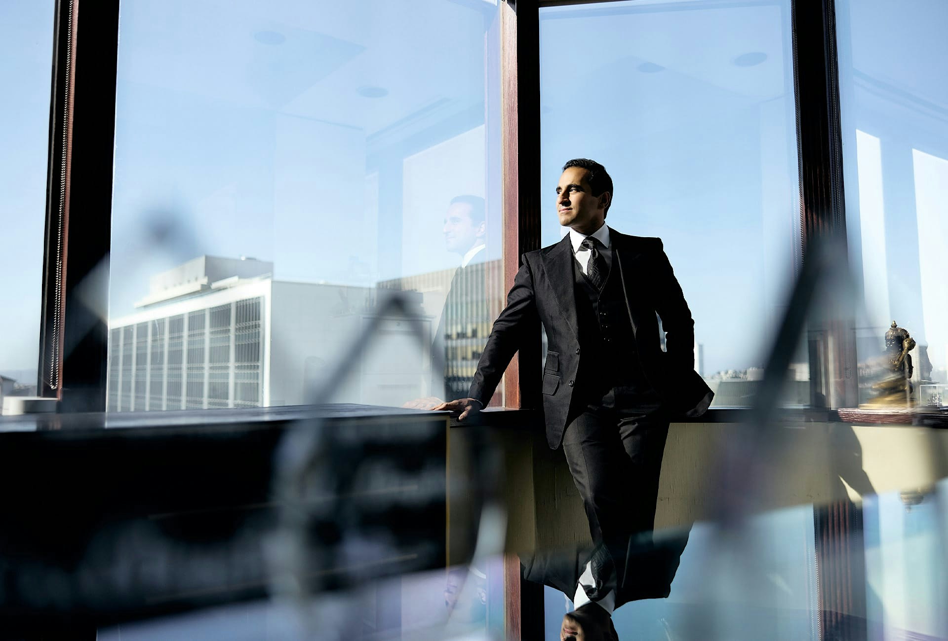 Dr. Dugar sitting by big windows