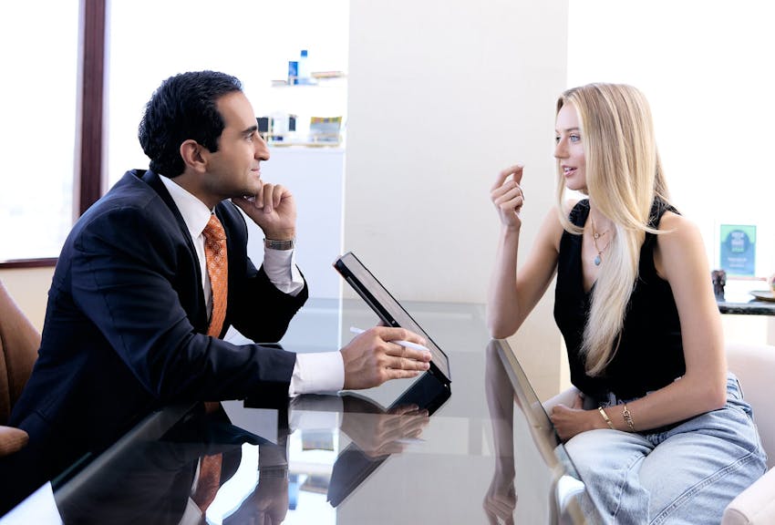 Dr. Dugar consulting with a patient