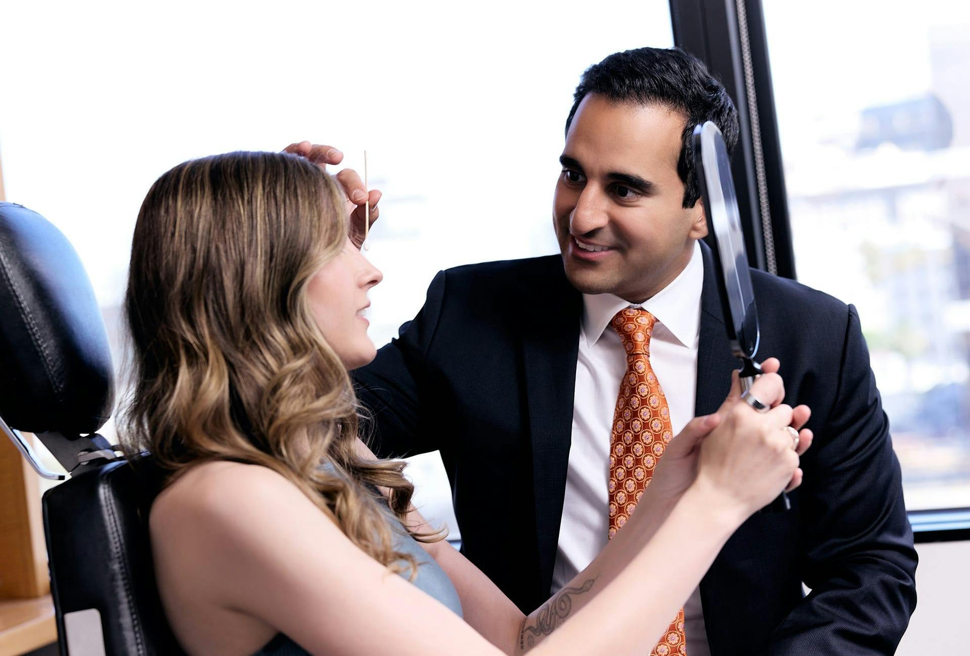 Dr. Dugar looking at a patient