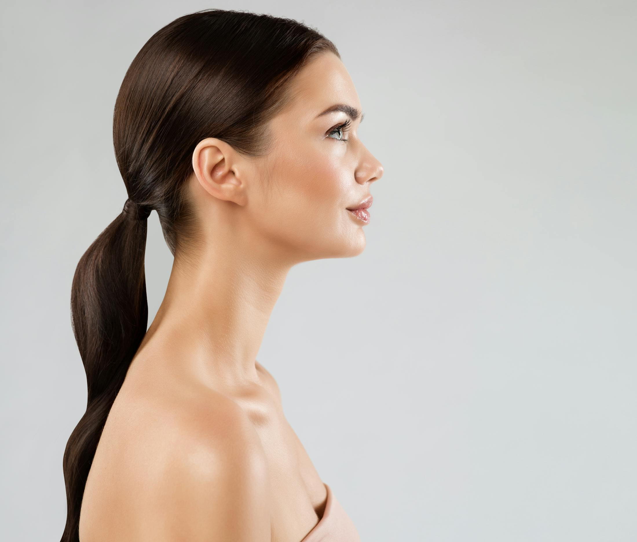 Side-profile of a brunette woman