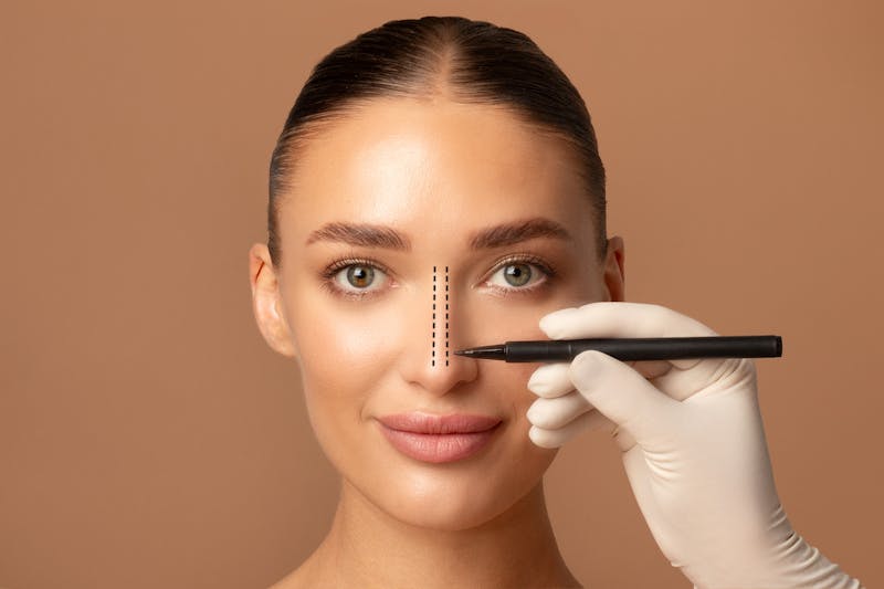 Young woman preparing for cosmetic surgery, rhinoplasty operation