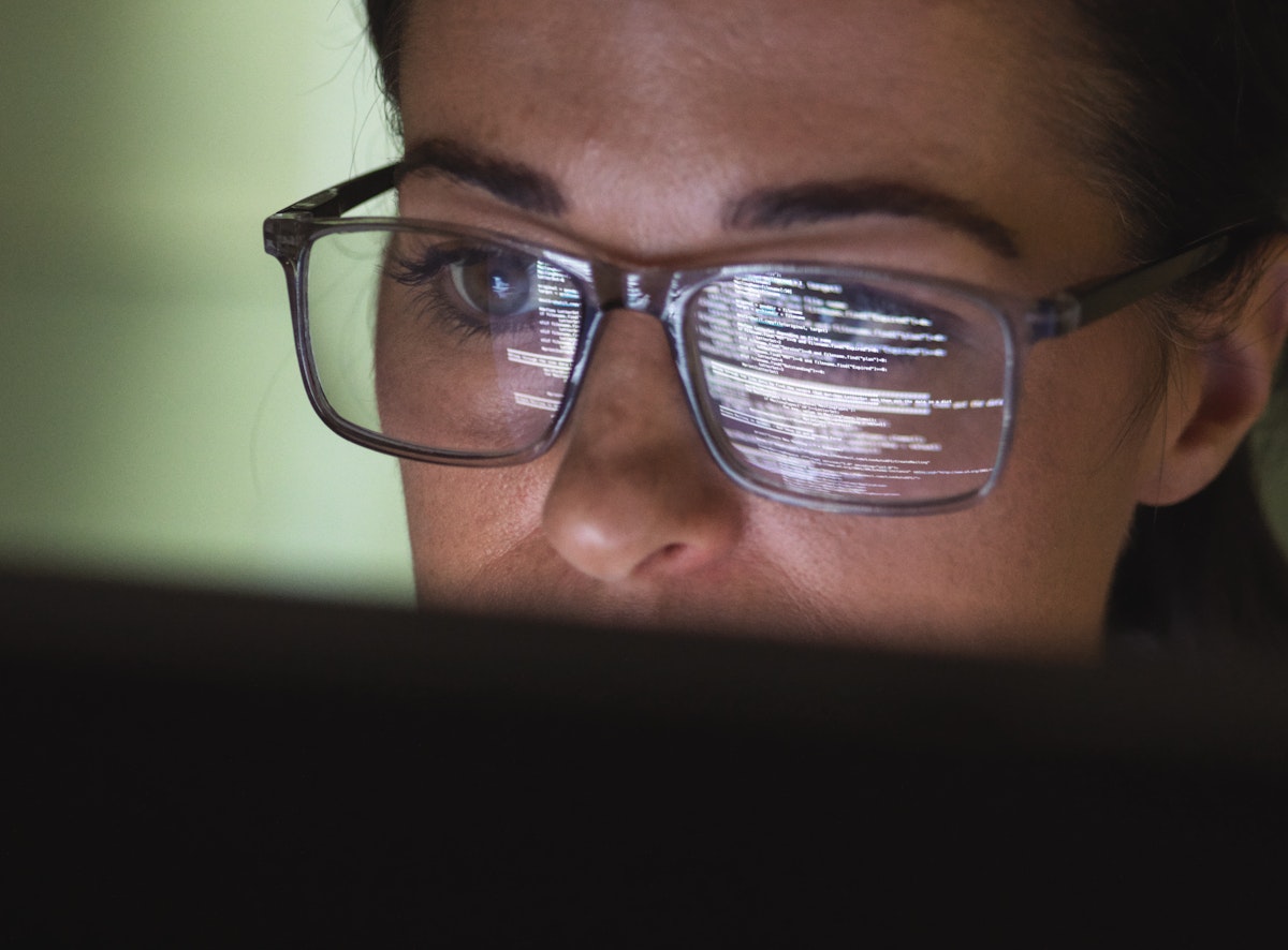 A lady looking at the computer