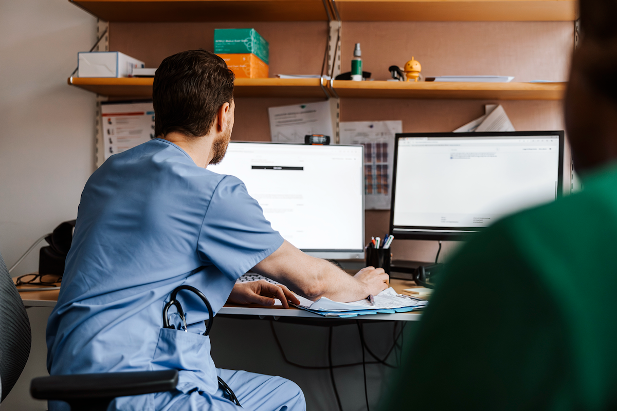 Male nurse on computer