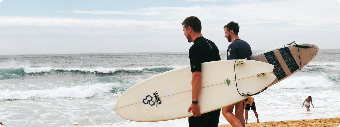 Two men surfing together