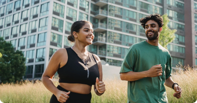A couple running together outdoors