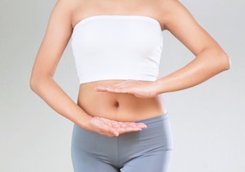 A lady highlighting her gut