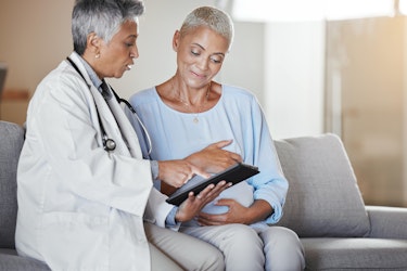 A doctor consulting a patient about their gut health