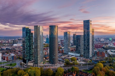 Modern skyline of Manchester city centre at sunset, representing local interest in DIY NAD therapy and NAD+ injections in the UK.