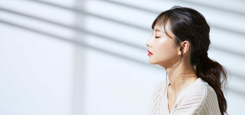 Woman with eyes closed