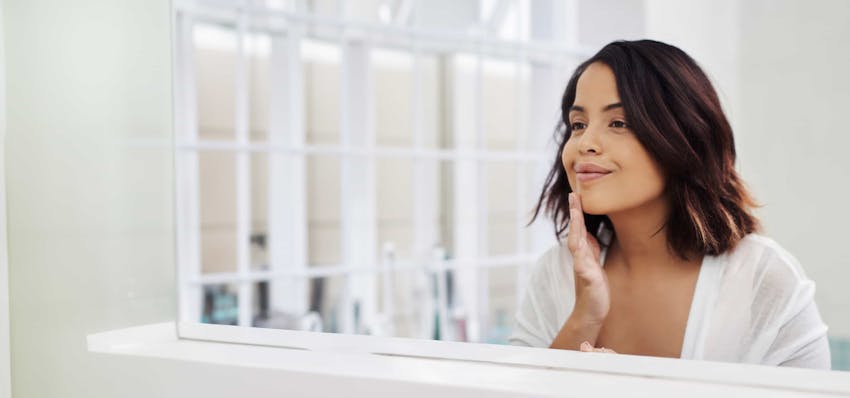 Woman smiling in mirror