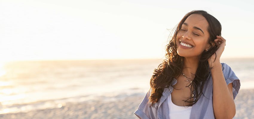 Woman smiling on the beach