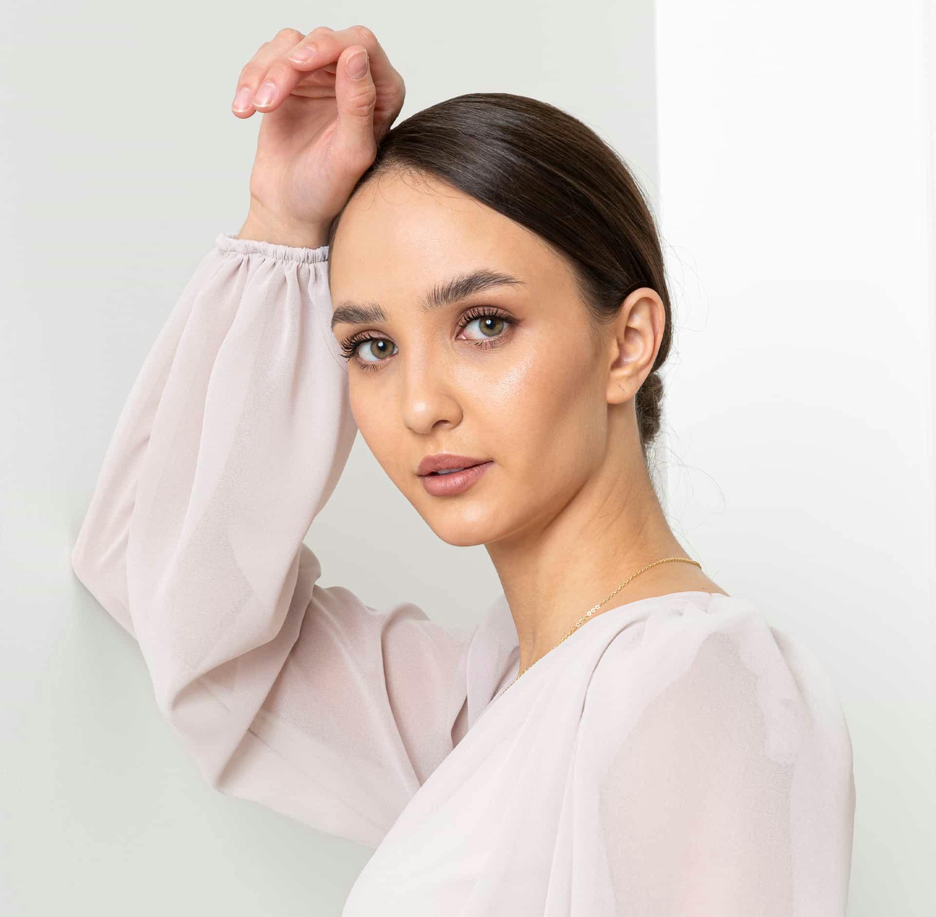 Woman posing with hand up