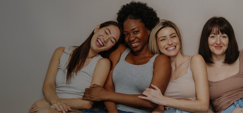 4 women smiling
