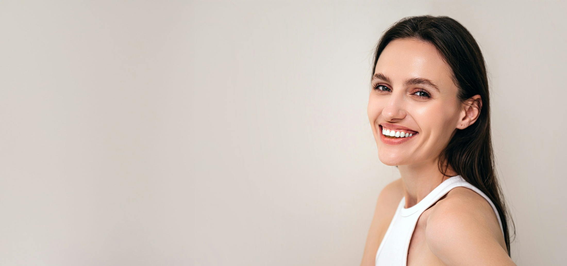 Woman with eyes closed smiling