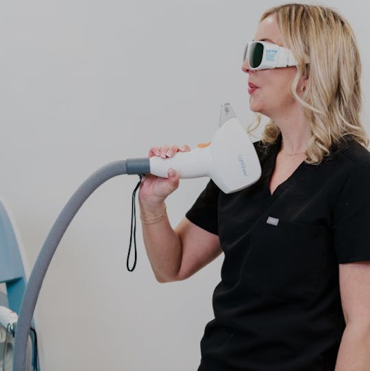 Woman with Light Machine