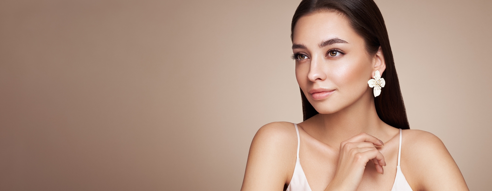 woman in white flower earrings