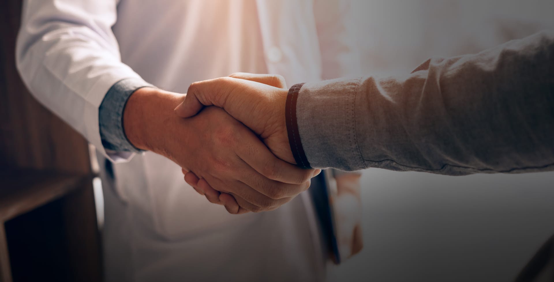 Doctor shaking hands with a patient