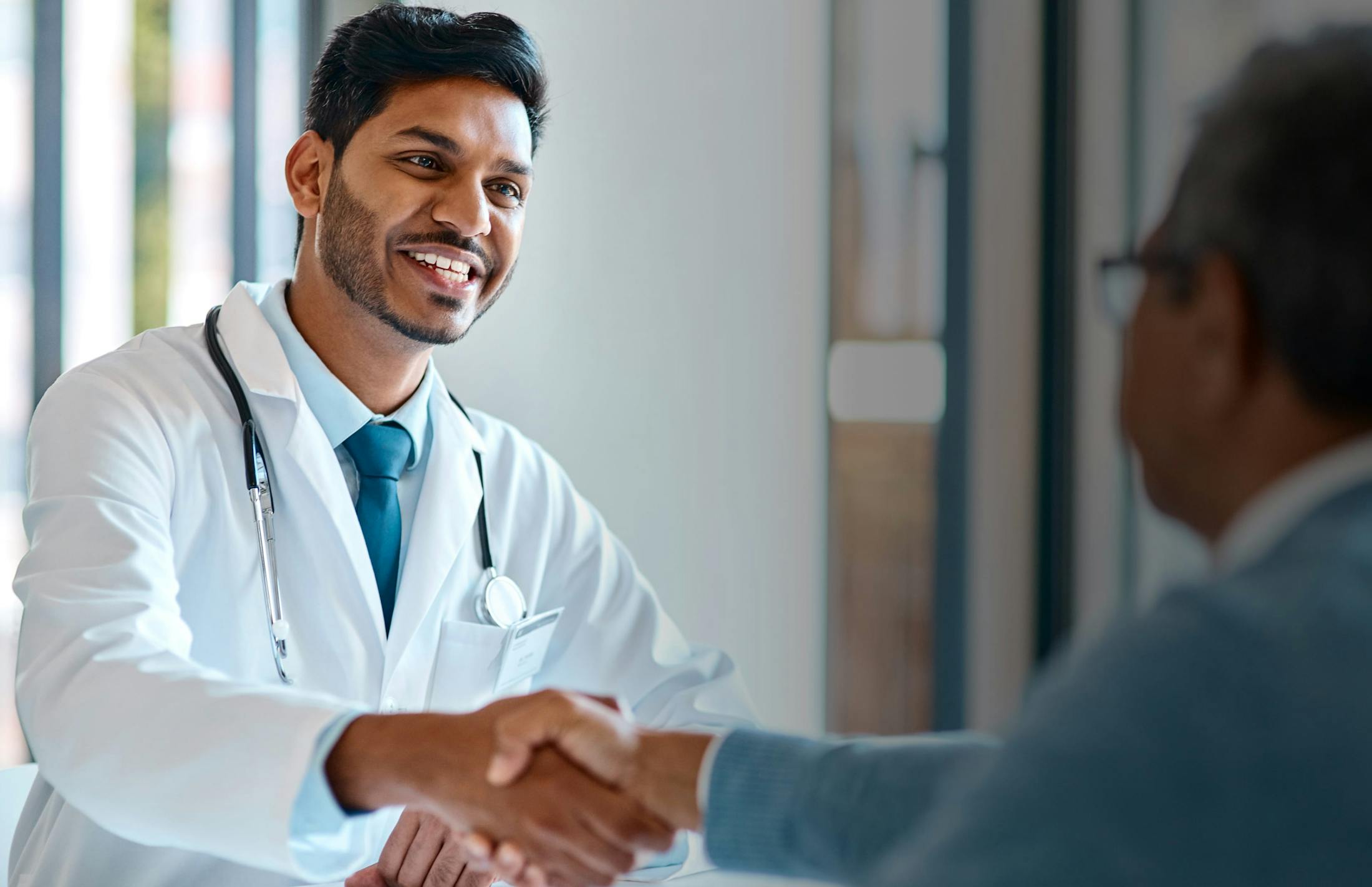 Doctor shaking a mans hand