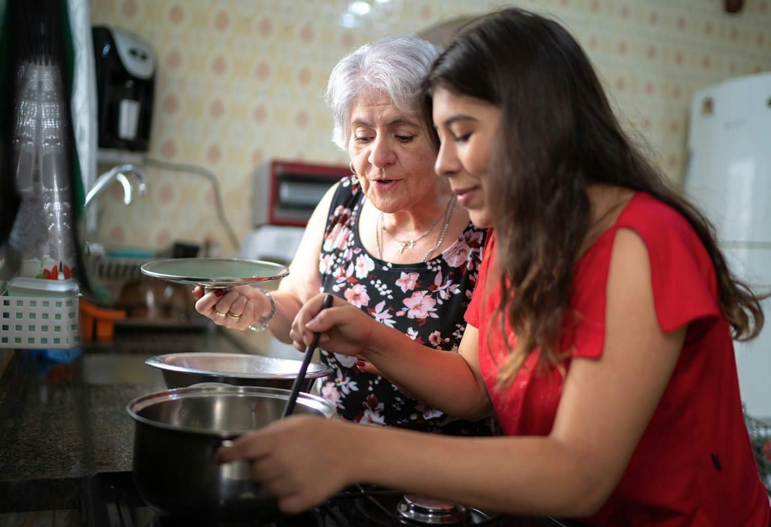 Two women cooking
