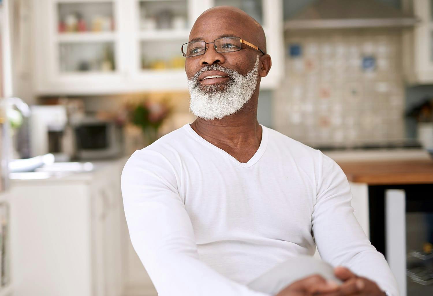 Man in a white shirt sitting down