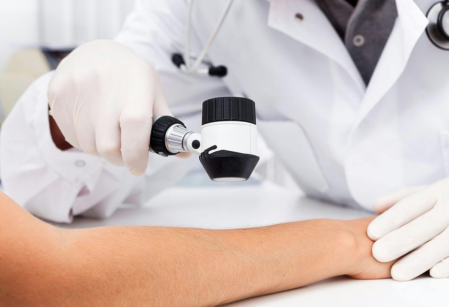 Person getting their hand examined