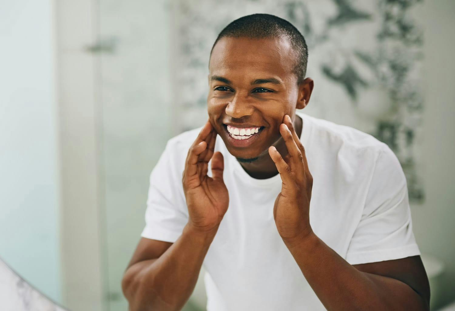 Man smiling in the mirror