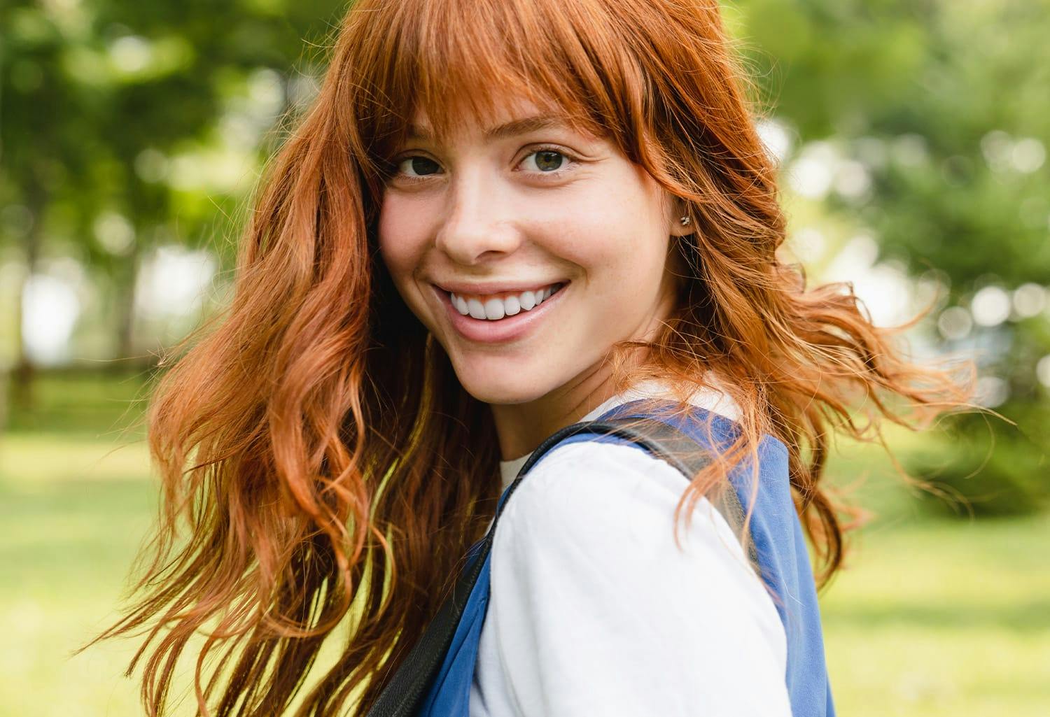Woman with red hair, smiling