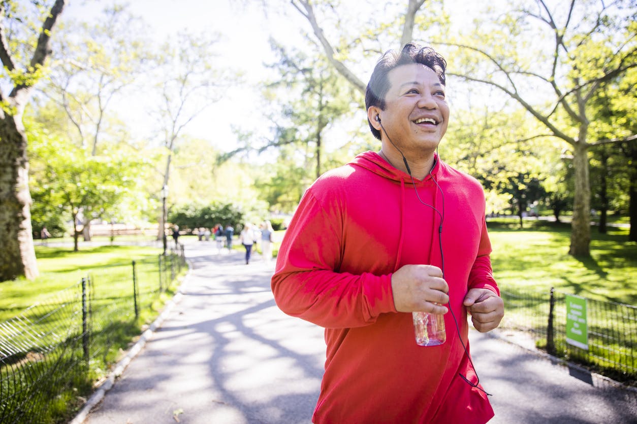 Man in red jacket jogging