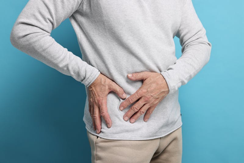 man with hands on his hip