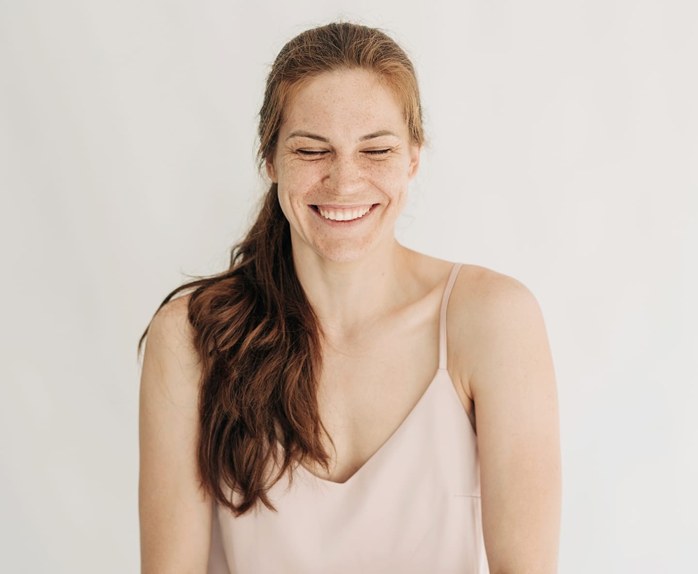 woman with side pony over her shoulder
