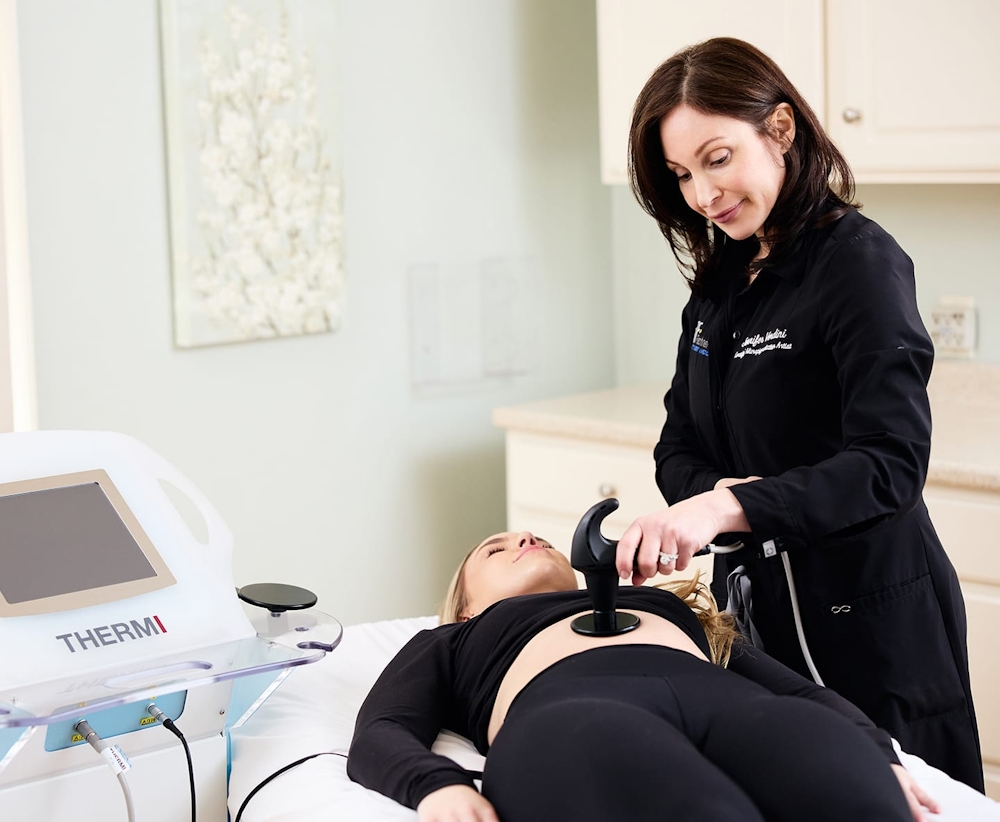 nurse doing skin tighting procedure on patient