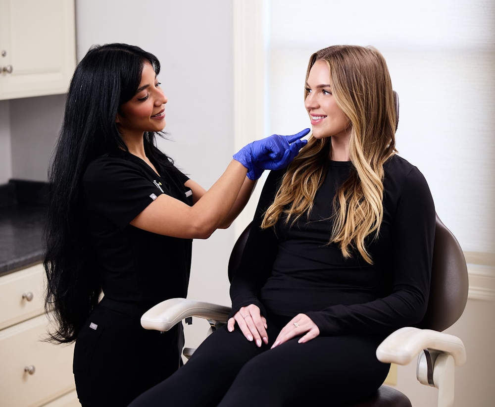 nurse with patient in chair