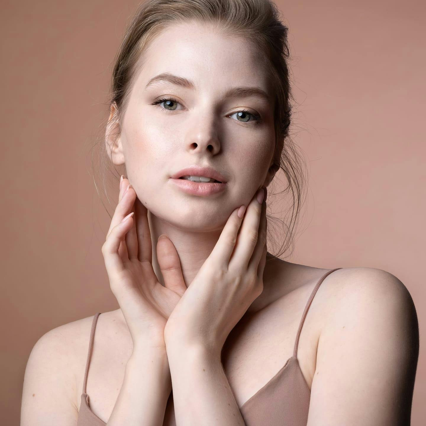 woman touching her jaw