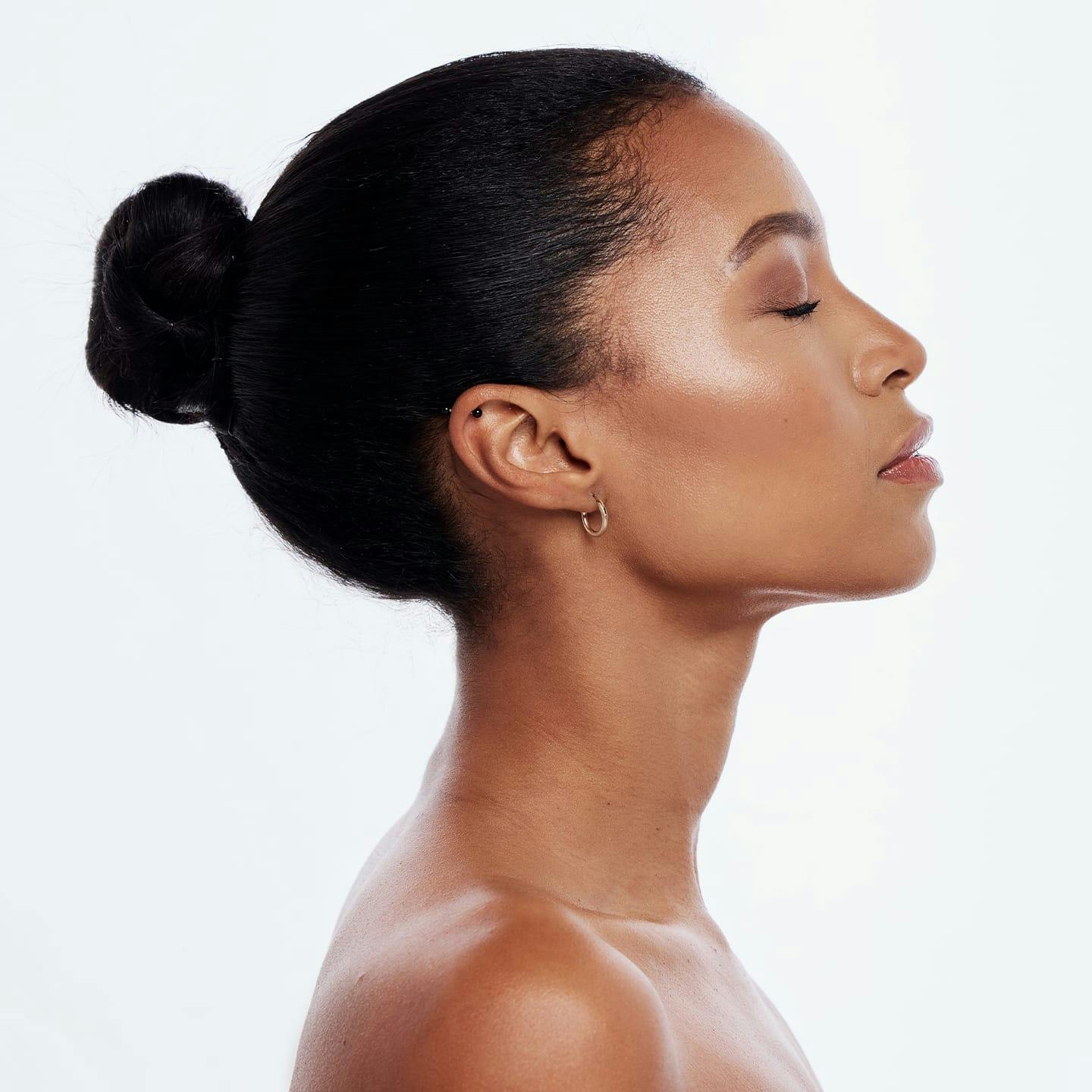 african american woman with hair in bun side profile