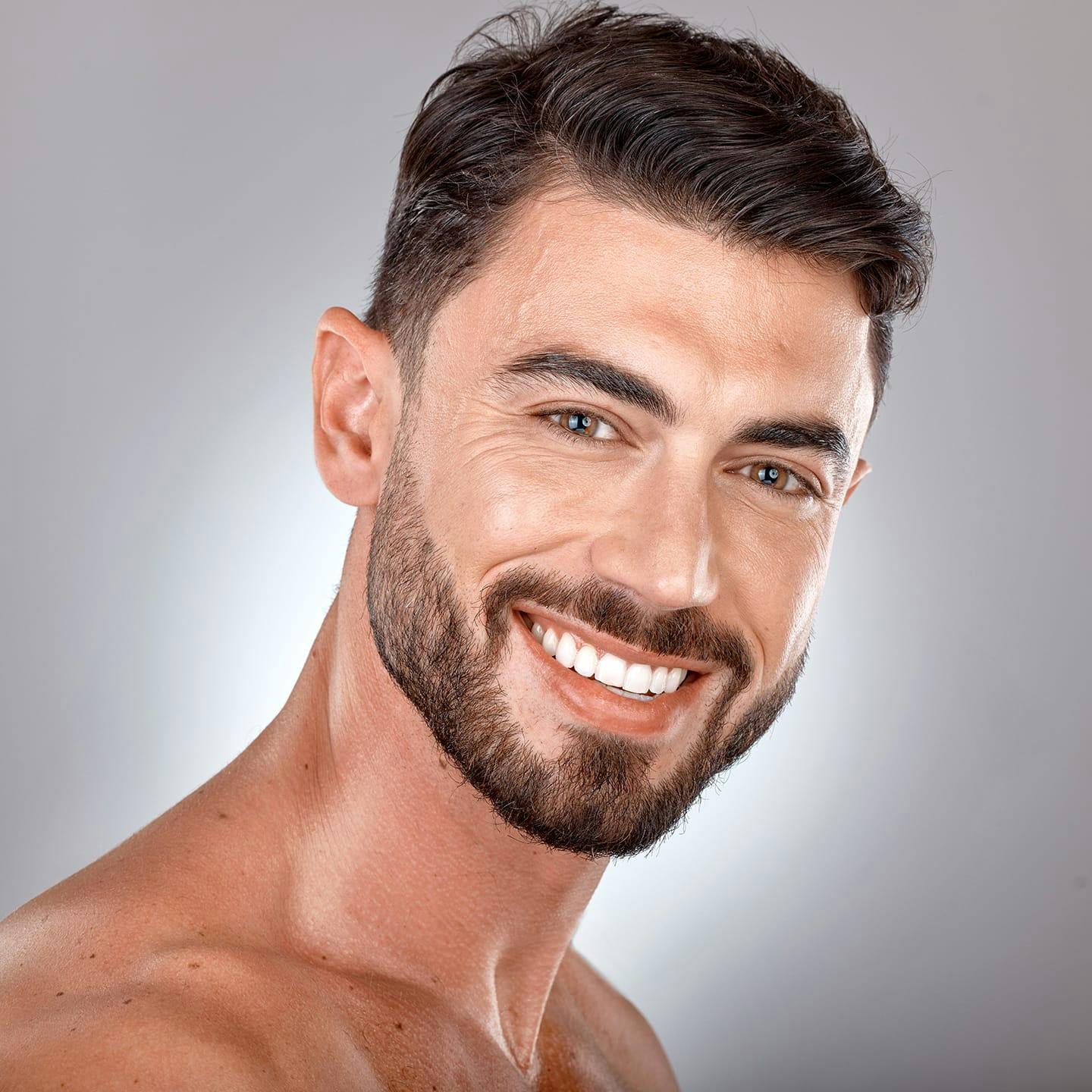 man with beard smiling forward