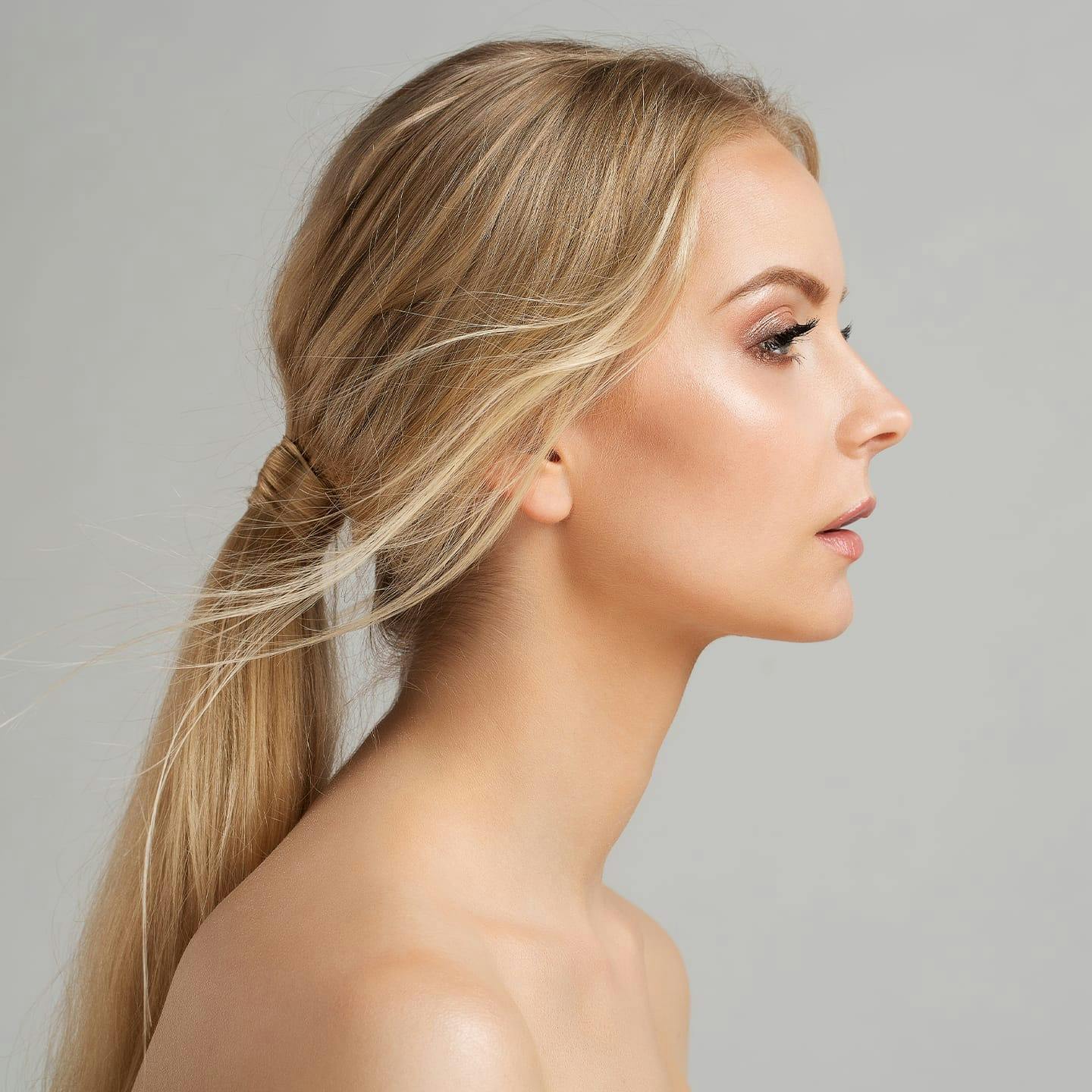 side profile of woman with blonde ponytail