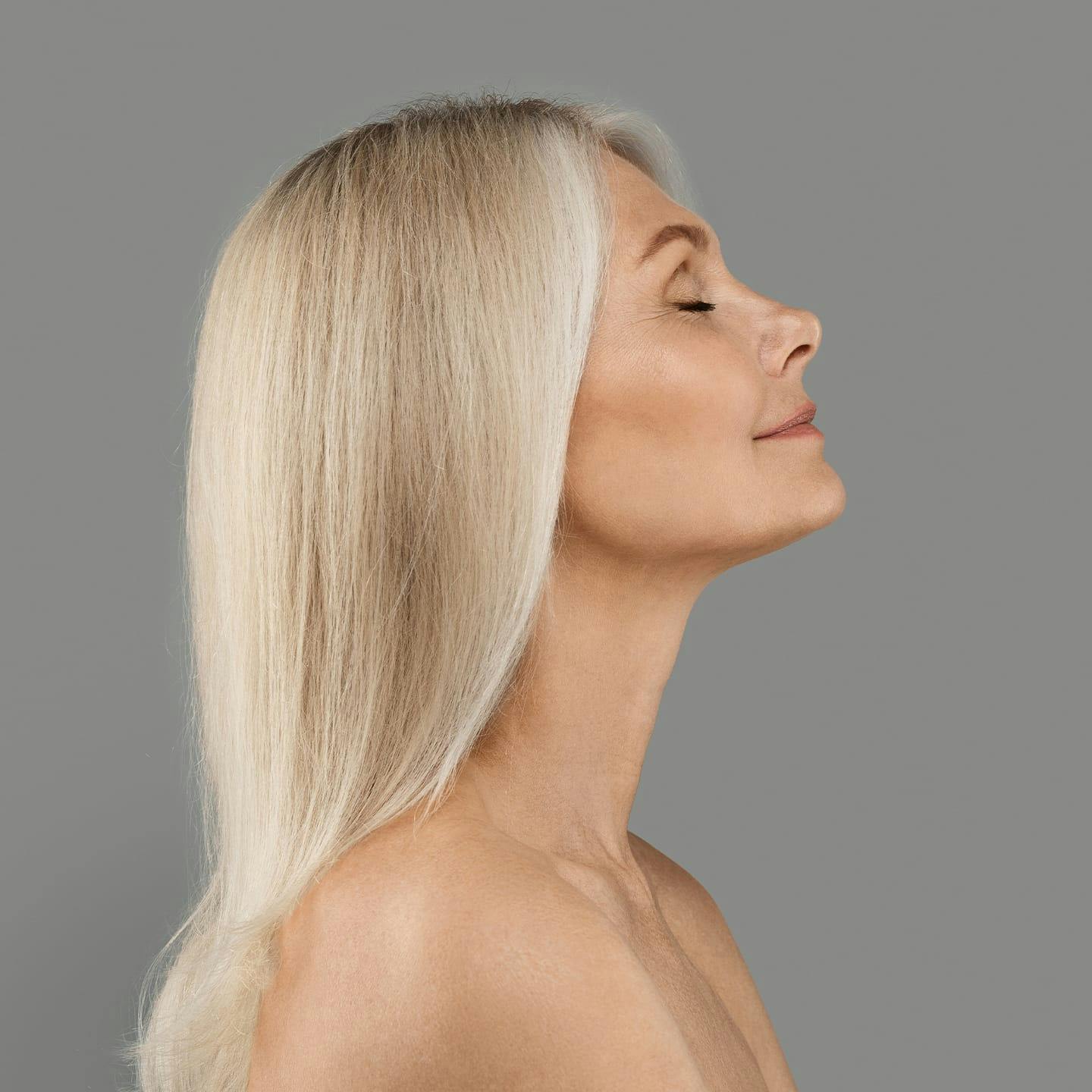 woman with blonde hair facing to the right