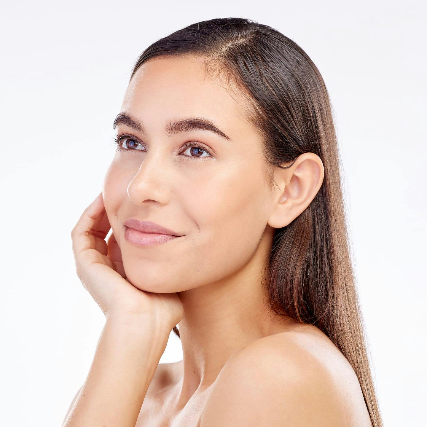 woman resting her chin on her hand