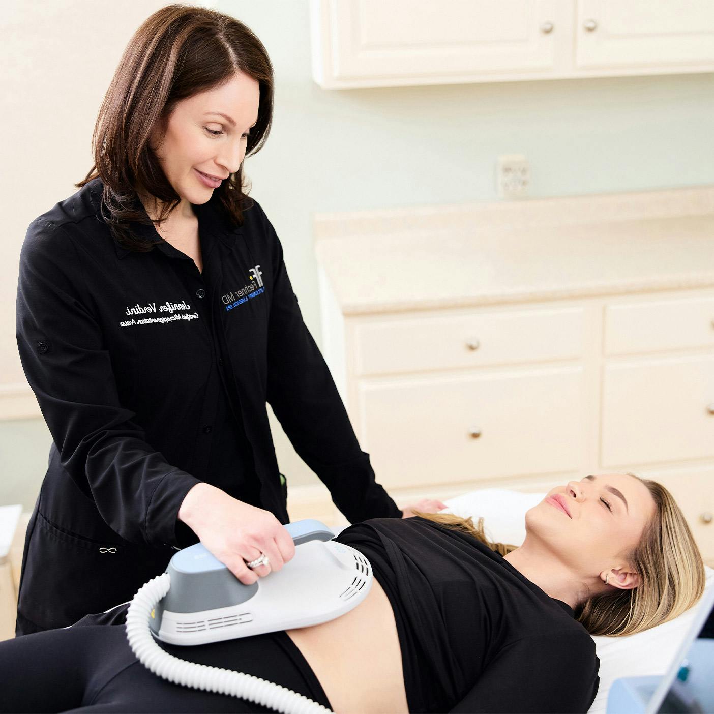 woman getting an EmSculpt procedure