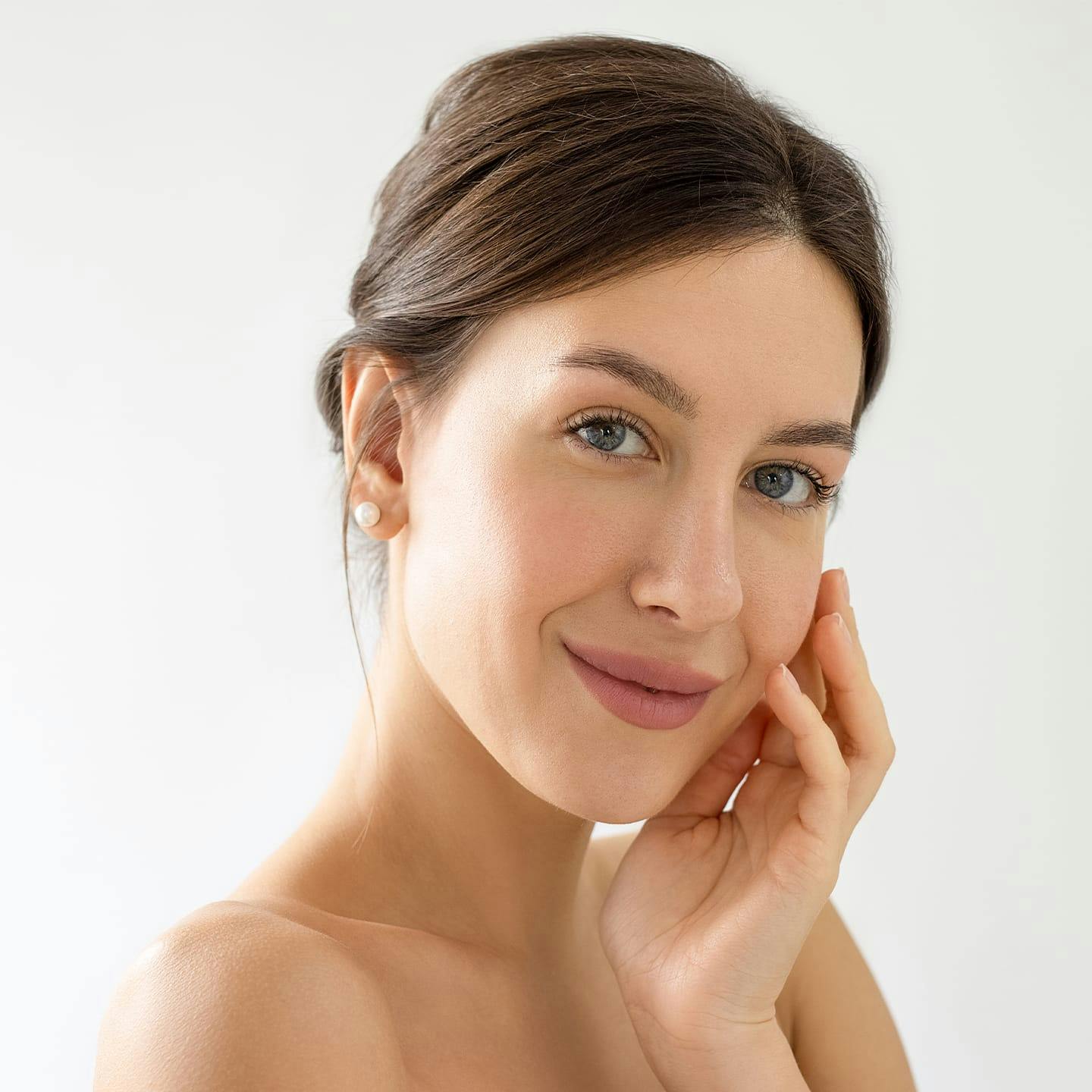 older man in white shirt smiling