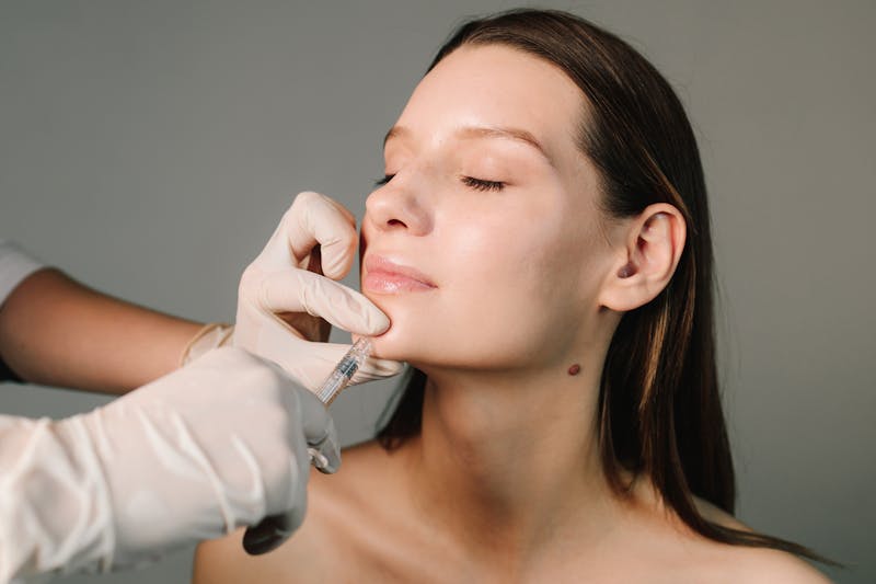Woman getting filler on her jawline
