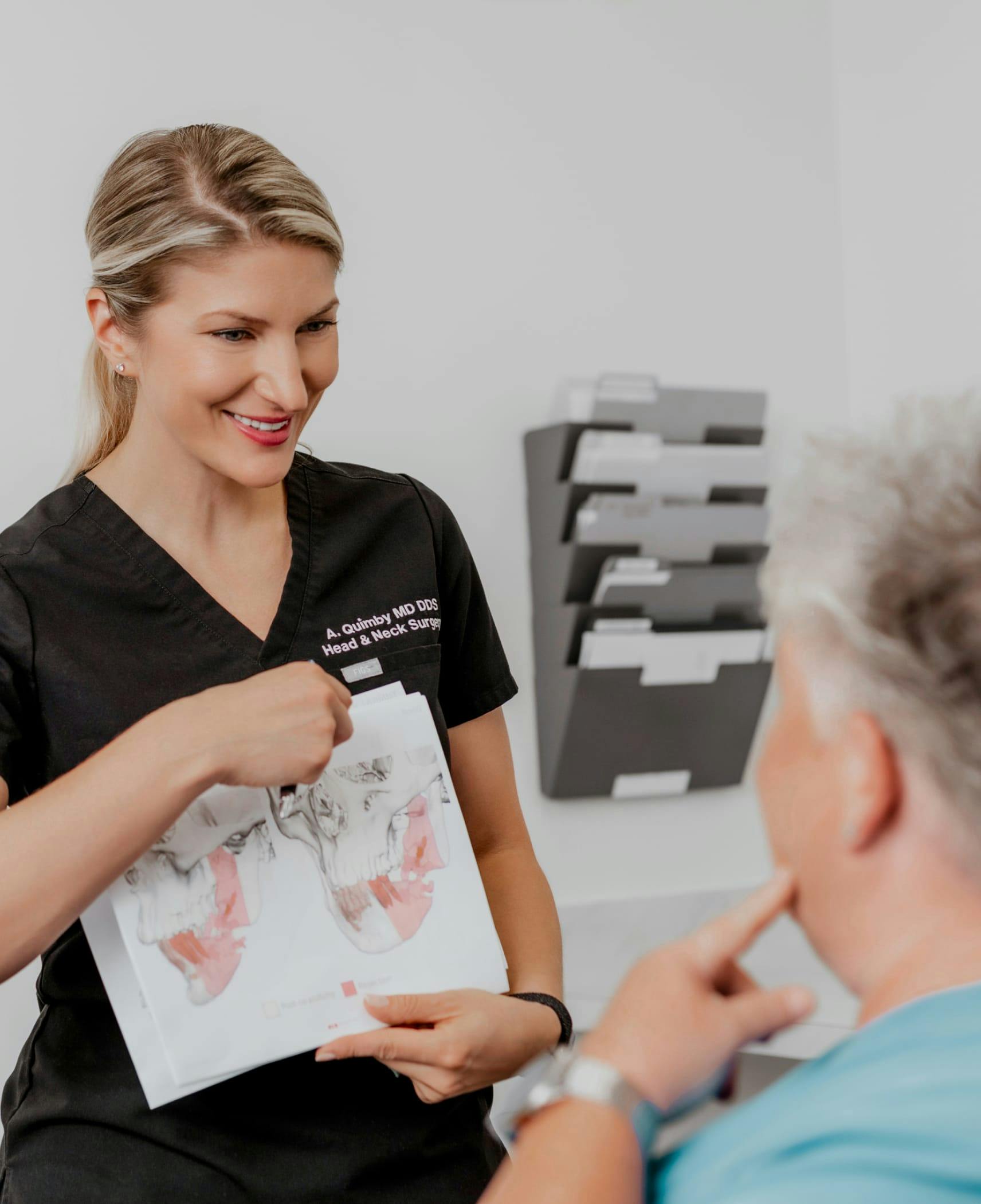 Dr. Quimby consulting with patient